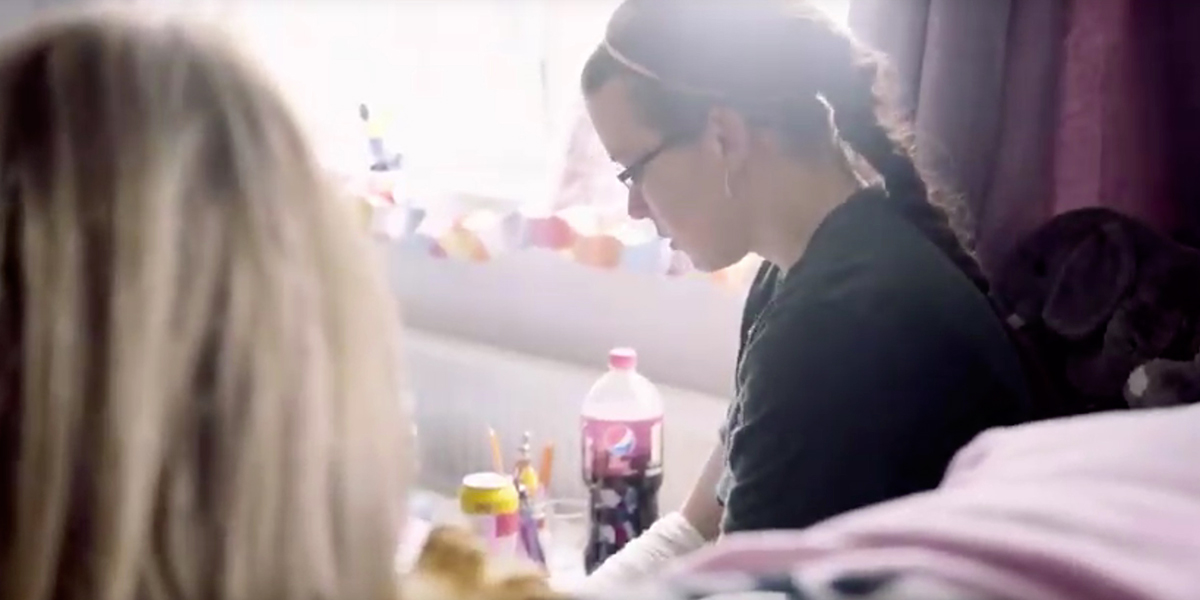 Louise in her new home sitting by the window.